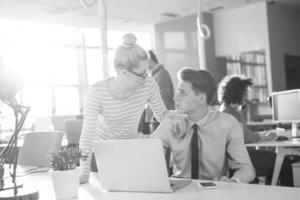 Two Business People Working With laptop in office photo