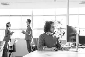 businessman working using a computer in startup office photo