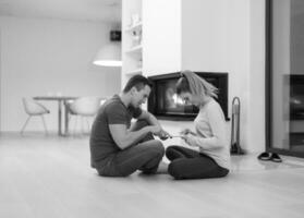 Young Couple using digital tablet on cold winter night photo