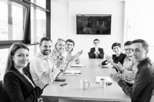 Group of young people meeting in startup office photo