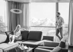 couple relaxing at  home using tablet computer photo
