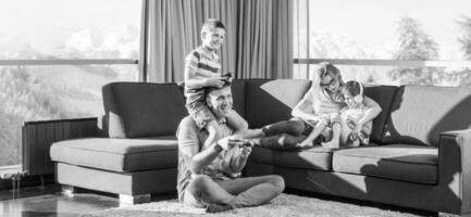 Happy family playing a video game photo