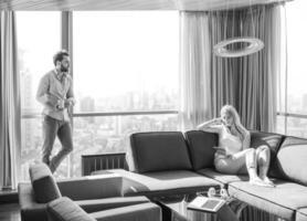 couple relaxing at  home using tablet computer photo