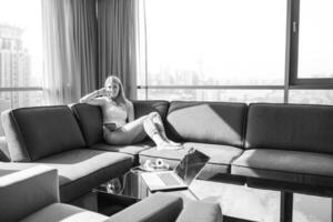 couple relaxing at  home using tablet computer photo