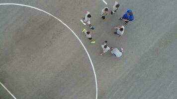 top view drone flying above amateur soccer game match. Countryside authentic tournament. photo