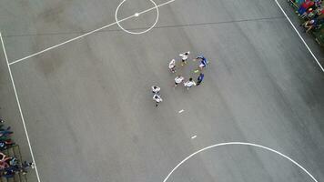 top view drone flying above amateur soccer game match. Countryside authentic tournament. photo