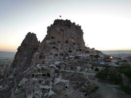Aerial cinematic drone view of colorful hot air balloon flying over Cappadocia photo