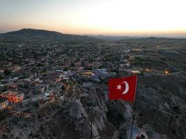 Flag of Turkey in Cappadocia. Epic cinematic tracking orbiting aerial view shoot photo