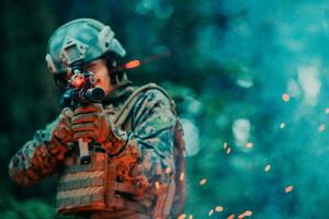 A soldier fights in a warforest area surrounded by fire photo