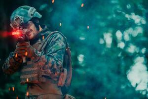 A soldier fights in a warforest area surrounded by fire photo