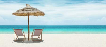 Relax on tropical beach in the sun on deck chairs. photo