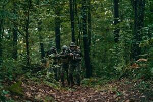 A group of modern warfare soldiers is fighting a war in dangerous remote forest areas. A group of soldiers is fighting on the enemy line with modern weapons. The concept of warfare and military conflicts photo