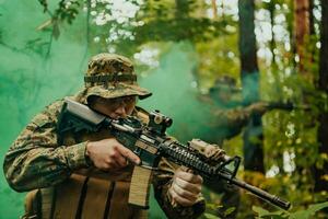 Battle of the military in the war. Military troops in the smoke photo