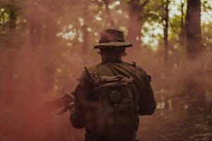 Battle of the military in the war. Military troops in the smoke photo