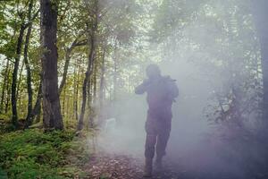 Battle of the military in the war. Military troops in the smoke photo