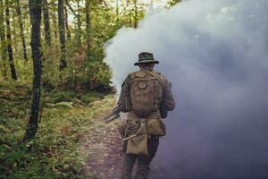 Battle of the military in the war. Military troops in the smoke photo