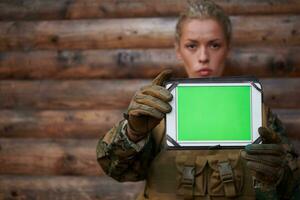 woman soldier using tablet computer photo