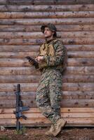 soldier using tablet computer in military camp photo