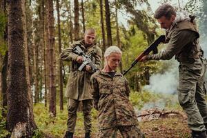 Terrorists was capture alive woman soldier and interrogation her on special tactics violent way photo