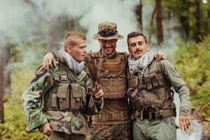 Group of soldiers in oposit sides celebrating peace after battle photo