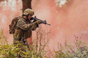 Battle of the military in the war. Military troops in the smoke photo