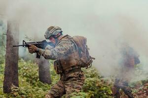 Battle of the military in the war. Military troops in the smoke photo