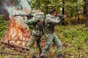 Angry terrorist militant guerrilla soldier warrior in forest photo