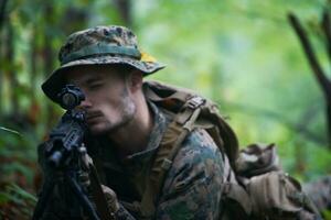 soldier in action aiming  on weapon  laser sight optics photo