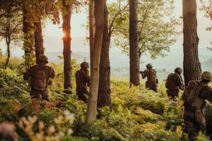 A group of modern warfare soldiers is fighting a war in dangerous remote forest areas. A group of soldiers is fighting on the enemy line with modern weapons. The concept of warfare and military conflicts photo