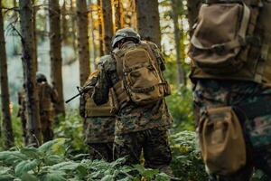 A group of modern warfare soldiers is fighting a war in dangerous remote forest areas. A group of soldiers is fighting on the enemy line with modern weapons. The concept of warfare and military conflicts photo