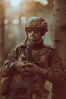 A modern warfare soldier on war duty in dense and dangerous forest areas. Dangerous military rescue operations photo