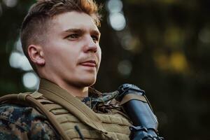 Soldier portrait with protective army tactical gear and weapon having a break and relaxing photo