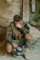 Upset soldier has psychological problems holding his head photo