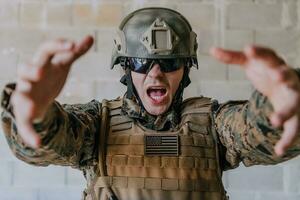 I choose you. A soldier with an outstretched hand towards the camera shows that he chooses you for support and partnership in warfare photo