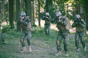 Modern warfare Soldiers  Squad  in battle photo