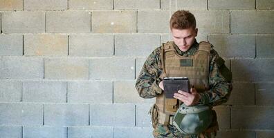 soldier using tablet computer photo