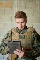 soldier using tablet computer photo