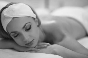 woman laying on massage table photo