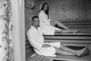 couple relaxing in the sauna photo