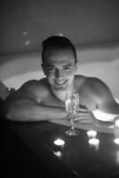 man relaxing in the jacuzzi photo