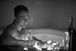 man relaxing in the jacuzzi photo