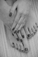 female feet and hands at spa salon photo