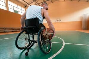 Close up photo of wheelchairs and handicapped war veterans playing basketball on the court