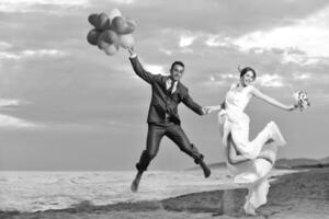 romantic beach wedding at sunset photo