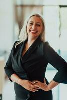 Portrait of a senior businesswoman in a modern corporation. Selective focus photo