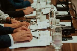 Close-up photo of businessmen who are at a meeting and business meeting in a modern hall