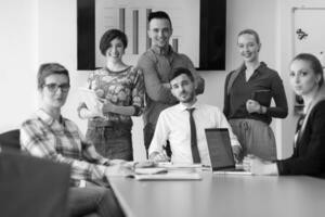 startup business team on meeting at modern office with sunset in background photo