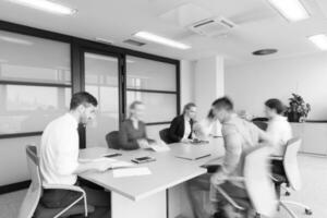 business people group entering meeting room  motion blur photo
