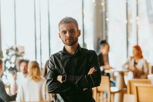 Cheerful self confident professional businessman with crossed hands portrait. photo