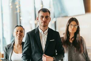 Group of successful business people standing together at office. photo